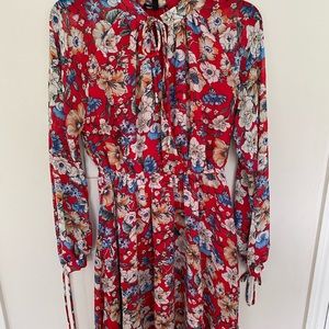 Red patterned dress. Above the knee. Size small.
